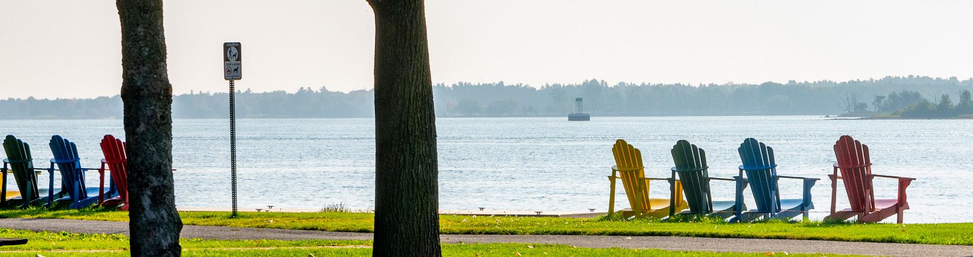 Adirondack chairs by the river