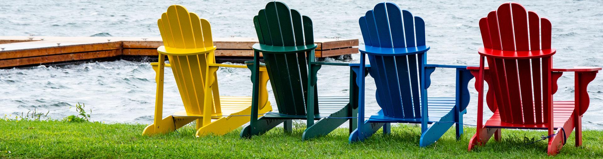Adirondack chairs by the river
