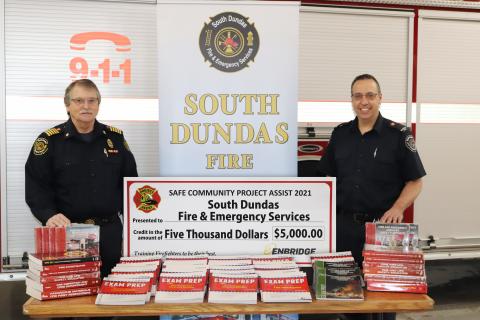 Chief Morehouse and Assistant Coordinator Paulino with training materials