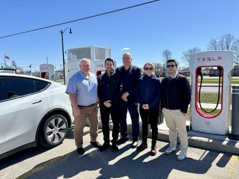 photo of mayor broad, cao mills and the tesla team.